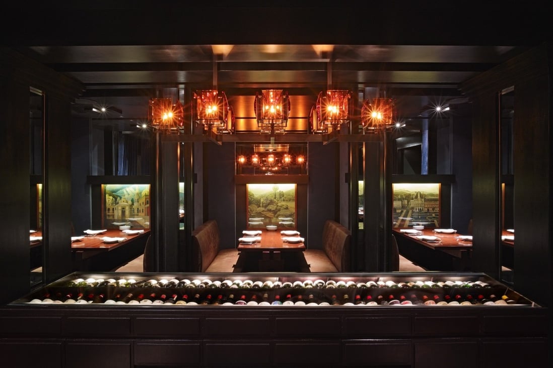 The interior of Grand Hyatt Steakhouse is outfitted in dark wood and leather booths. Photos: handouts