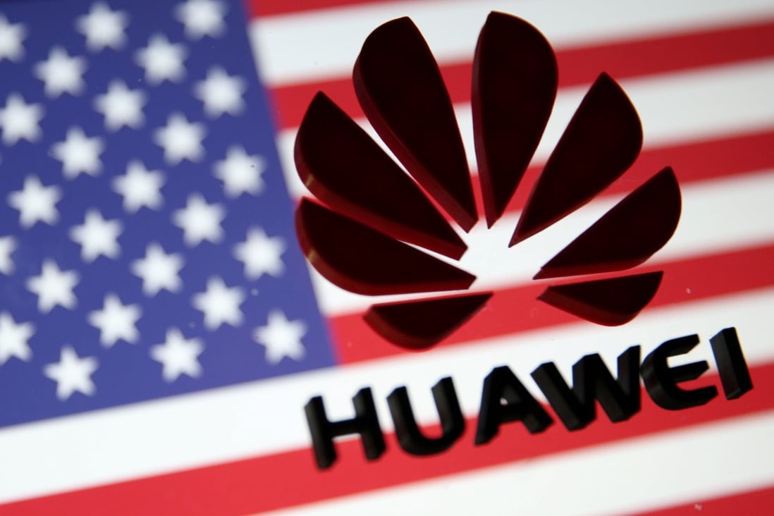 A 3D printed Huawei logo is placed on glass above a displayed US flag in this illustration taken January 29, 2019. Photo: Reuters