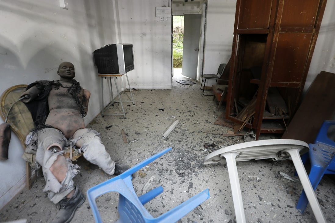 A dummy and mock living area were used to demonstrate the potential power of bombs being confronted by Hong Kong police. Photo: Sam Tsang