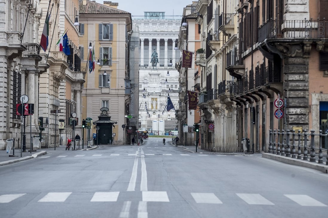 A deserted shopping street in Rome. Photo: AP