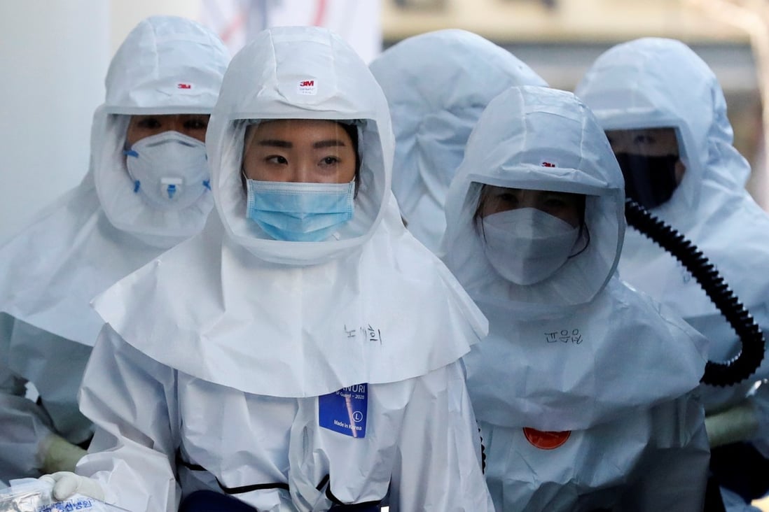 Medical workers head to a hospital facility to treat coronavirus patients in Daegu, South Korea. Photo: Reuters