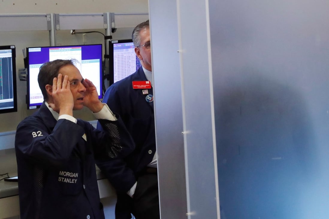 Traders look on as things go pear-shaped on the floor of the New York Stock Exchange on March 13, 2020. Photo: Reuters