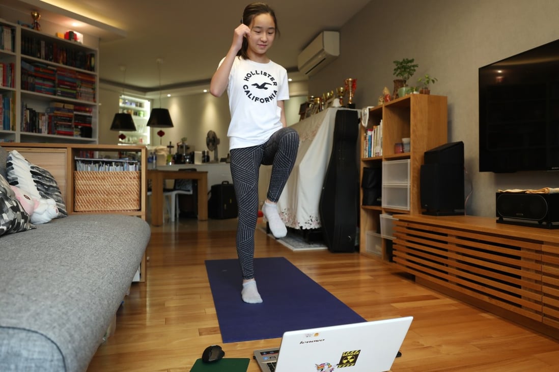 Kaitlyn Yu Ching, a Form One student at HKUGA College, attends an online physical education class from her home in Tai Koo. Photo: Xiaomei Chen