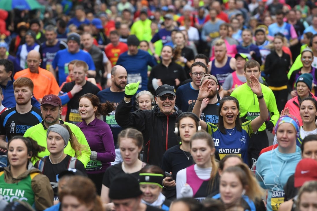 Runners take part in the Bath Half marathon run in Bath, Britain on Sunday. The UK government has not yet banned large gatherings. Photo: EPA