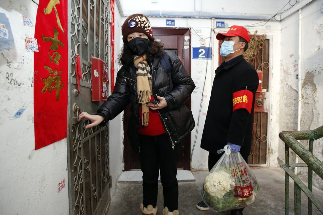Grass-roots party officials have been delivering food and medicine to Wuhan residents. Photo: Xinhua