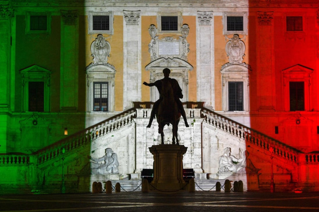The colours of the Italian flag are projected onto the Palazzo Senatorio building on Capitoline Hill in Rome on Tuesday as a “sign of hope in this difficult and delicate moment”, Rome’s mayor stated. Photo: AFP
