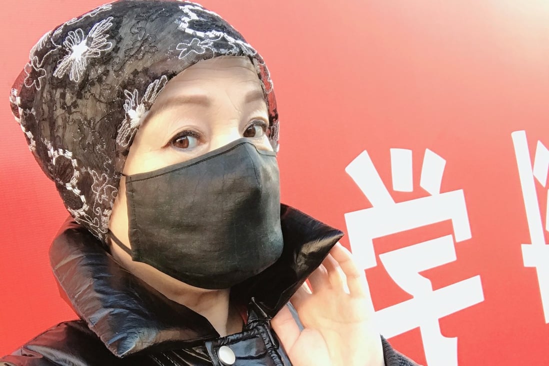 A woman wears a Kathrin von Rechenberg tea silk face mask in Beijing. The German fashion designer who is based in the Chinese capital used up scraps of silk from her studio making masks at a time when they were in short supply.