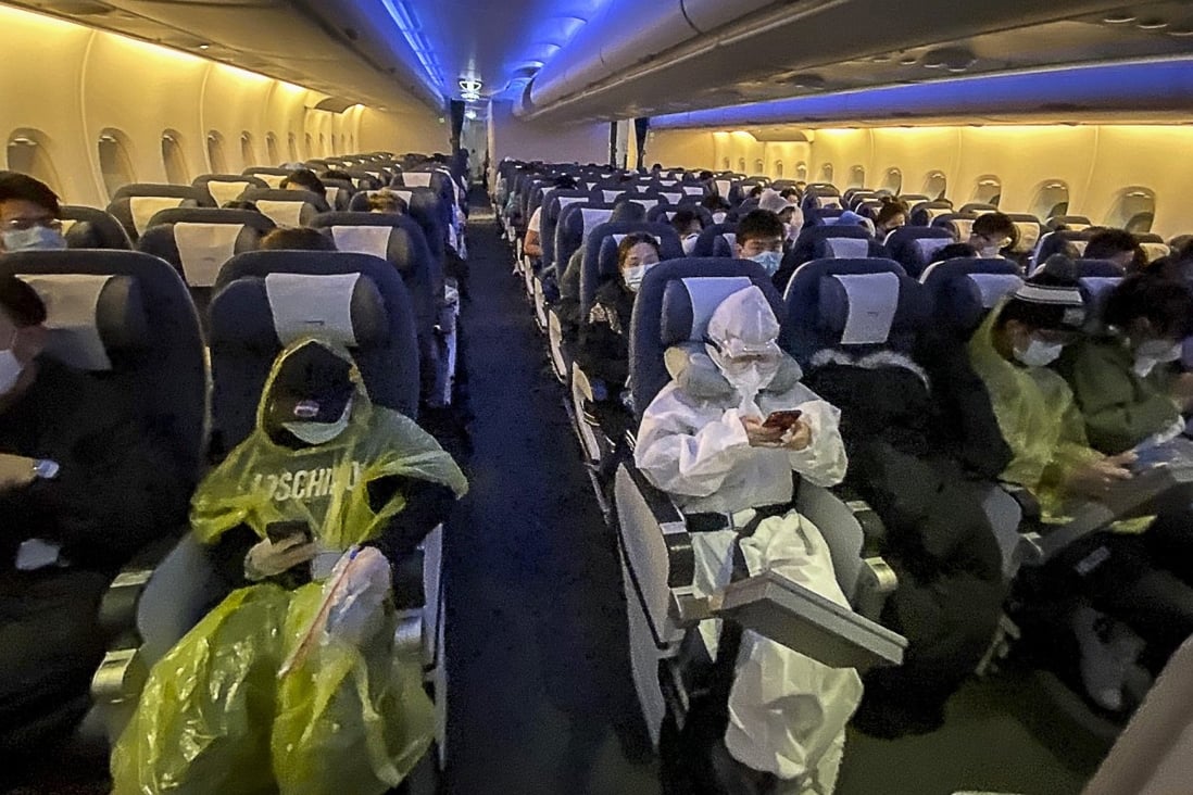 Passengers on a flight from London to Hong Kong are mostly decked out in protective gear. Photo: Emily Tsang