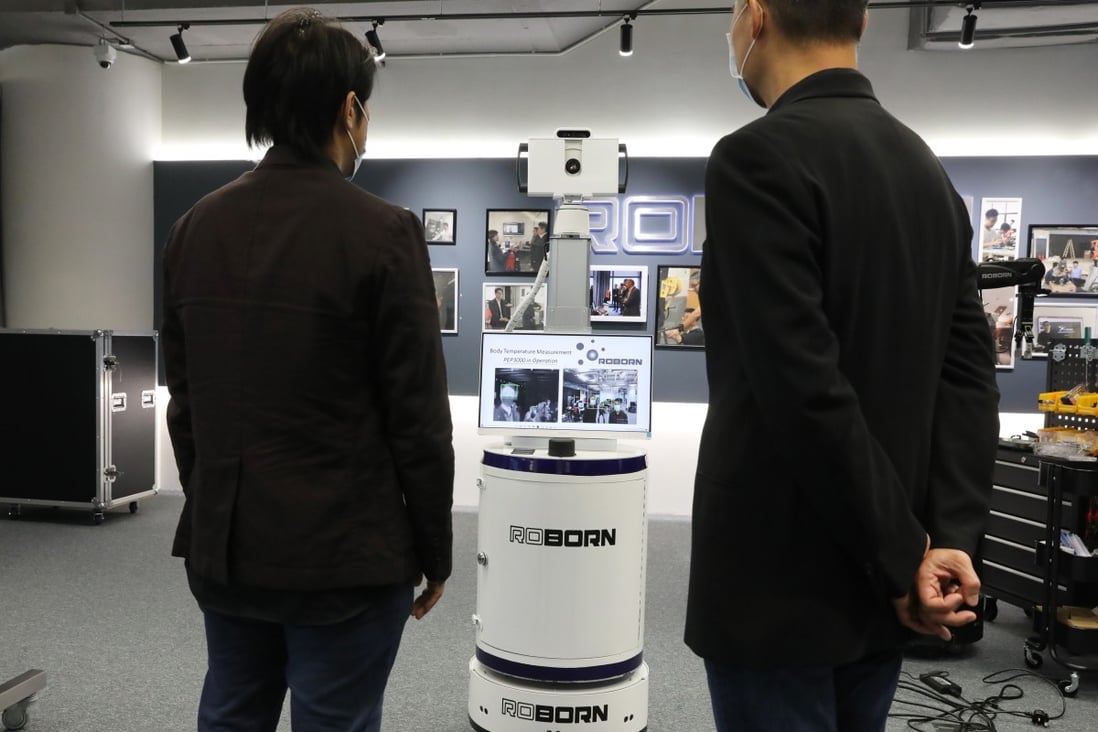 5G-enabled mobile robot scanning people's body temperature. Photo: K. Y. Cheng