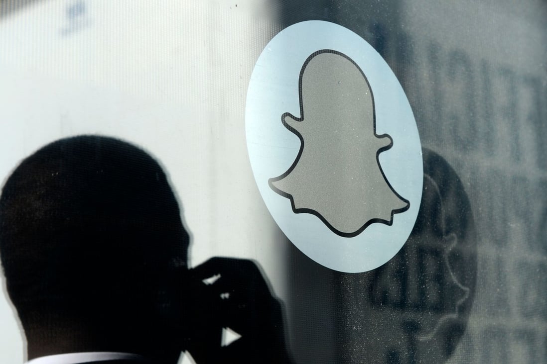 In this file photo taken on November 14, 2013, the logo of Snapchat is seen at the front entrance of new headquarters of Snapchat in Venice, California. Photo: AFP