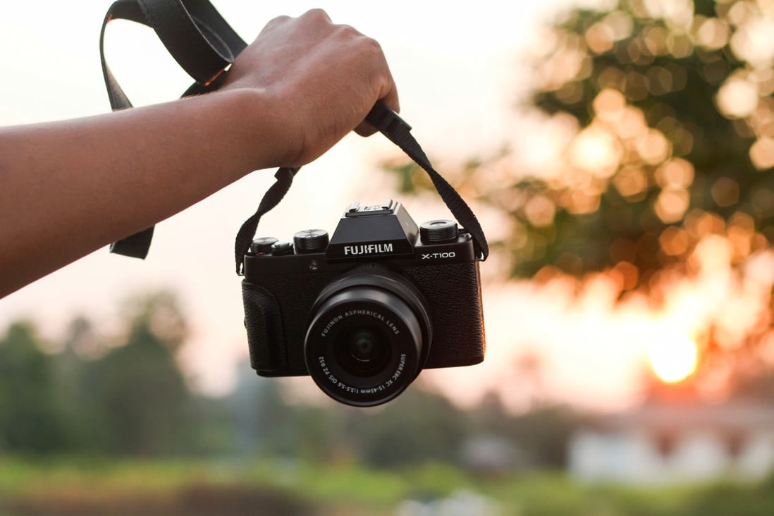 Leave your heavy DSLR behind and go lightweight, with equipment such as the Fujifilm X-T100 mirrorless camera. Photo: Shutterstock