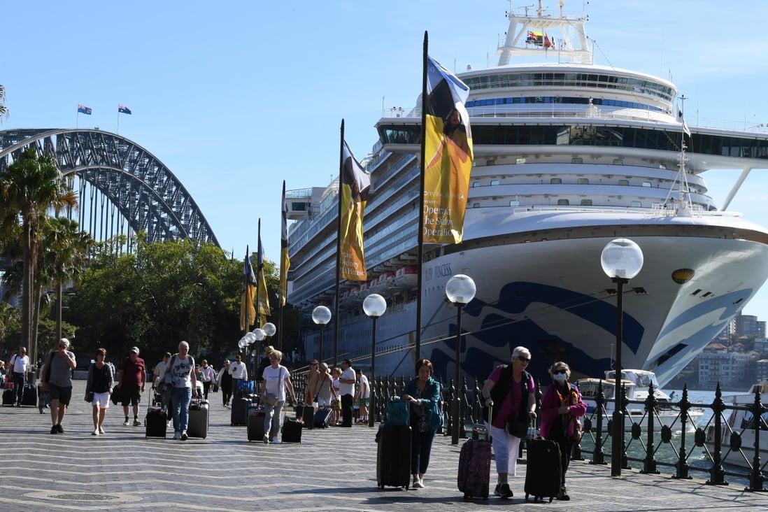 Cruise ship passengers disembark from the Ruby Princess at Circular Quay in Sydney. Photo: dpa