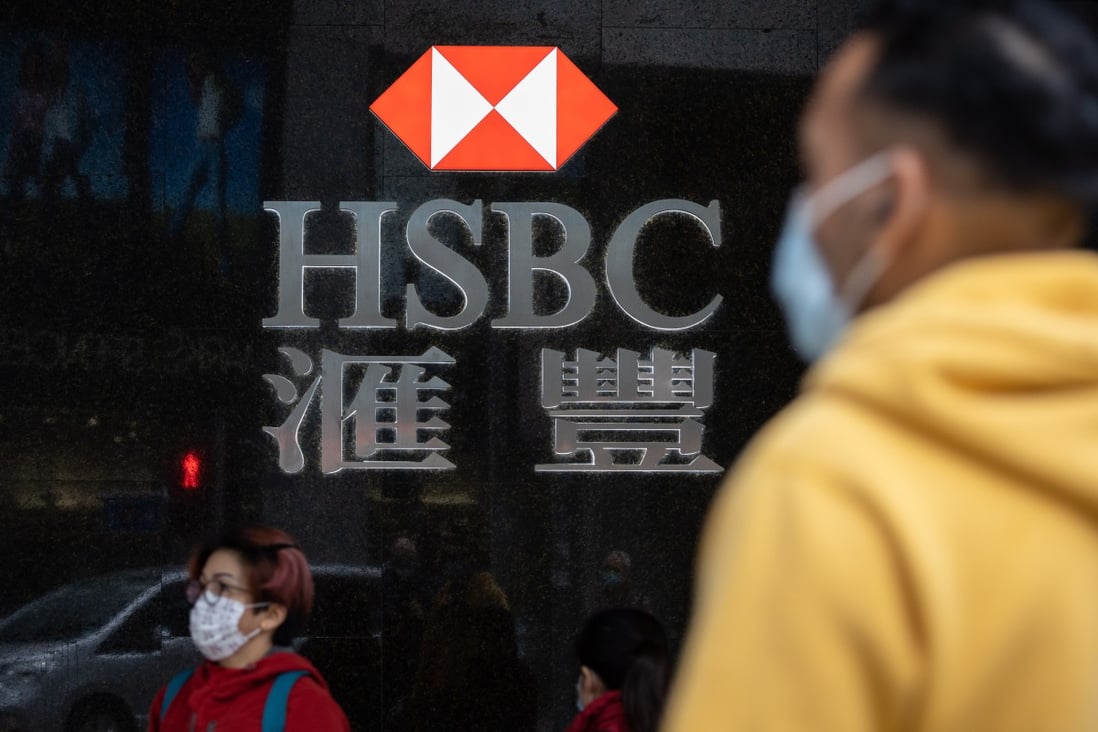 A man in a protective mask walks past an HSBC branch in Central district, Hong Kong. Photo: EPA