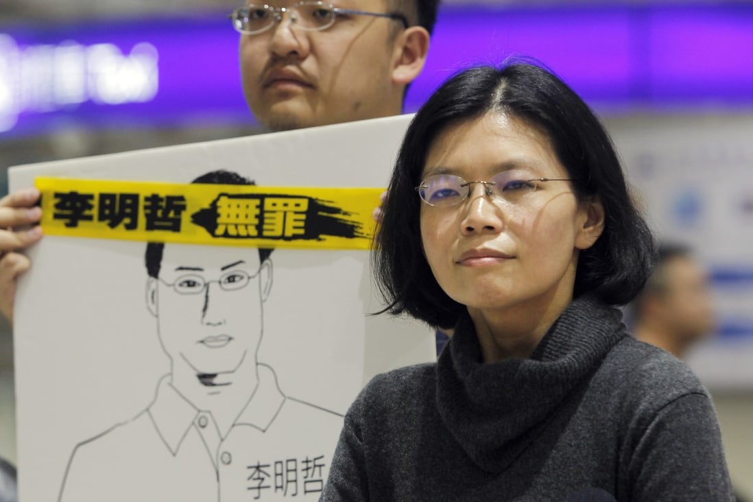 Lee Ching-yu, wife of Taiwanese activist Lee Ming-che jailed in China, answers questions during a press conference on March 28, 2019, as she arrives at Taoyuan International Airport. China banned her from visiting her husband in jail for three months, because of alleged improper behaviour. Photo: AP