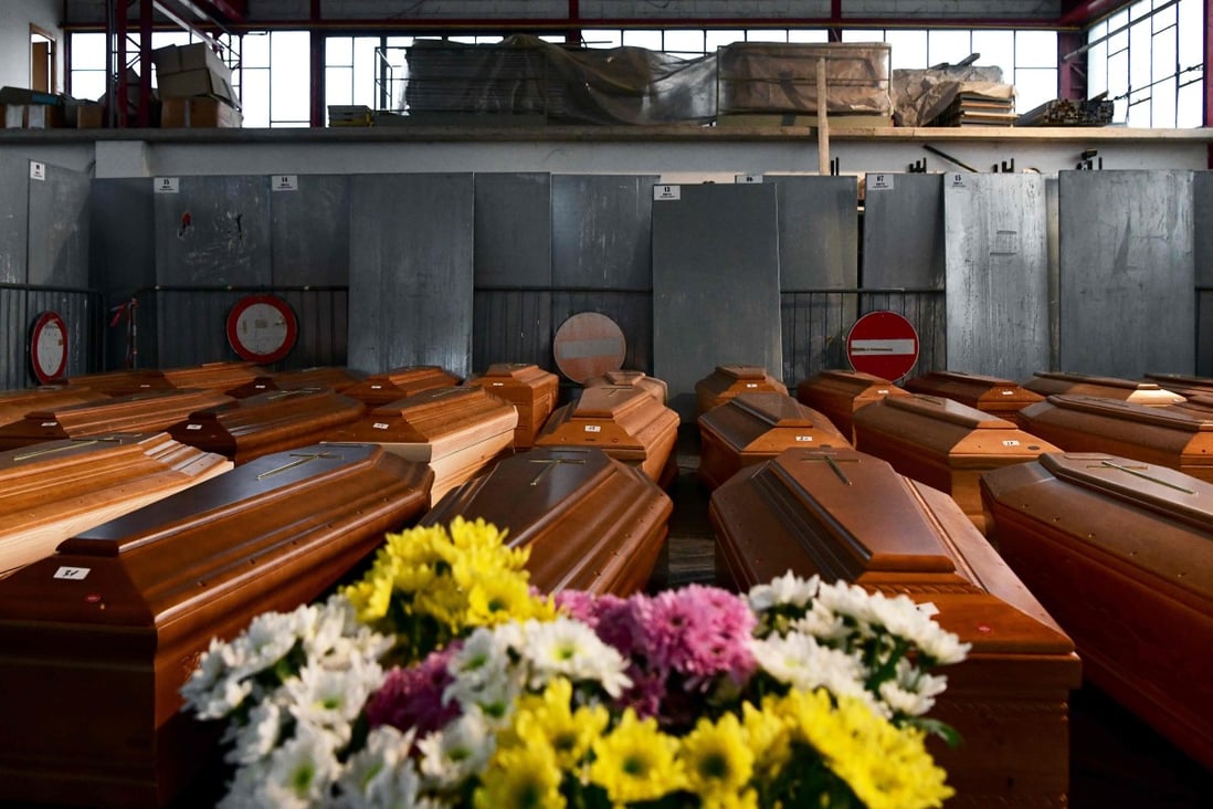 Some 35 coffins are stored in a warehouse in Ponte San Pietro, near Bergamo, Lombardy, on Thursday, before being transported elsewhere to be cremated. Photo: AFP