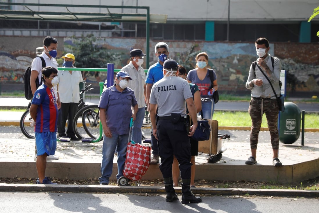 A police officer conducts quarantine checks on members of the public in the Peru capital of Lima. Photo: Reuters