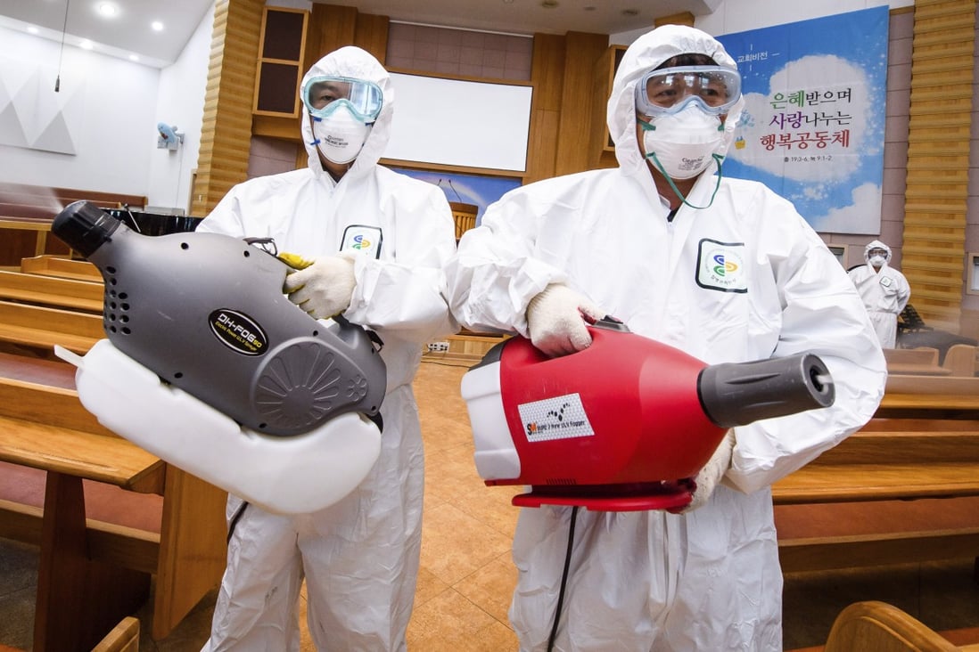 Workers spray disinfectant to help curb the spread of the coronavirus at a church in South Korea. A new cluster of infections has emerged at a church in Seoul’s western district of Guro. Photo: AP