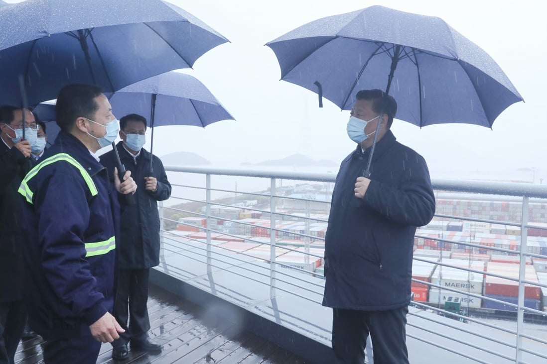 Chinese President Xi Jinping chats to workers and officials at Ningbo port in east China on Sunday. Photo: Xinhua