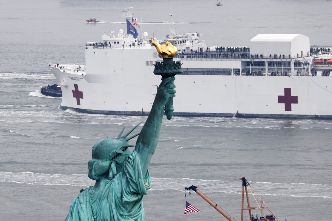 The USNS Comfort passes the Statue of Liberty as it enters New York Harbour on Monday. Photo: Reuters