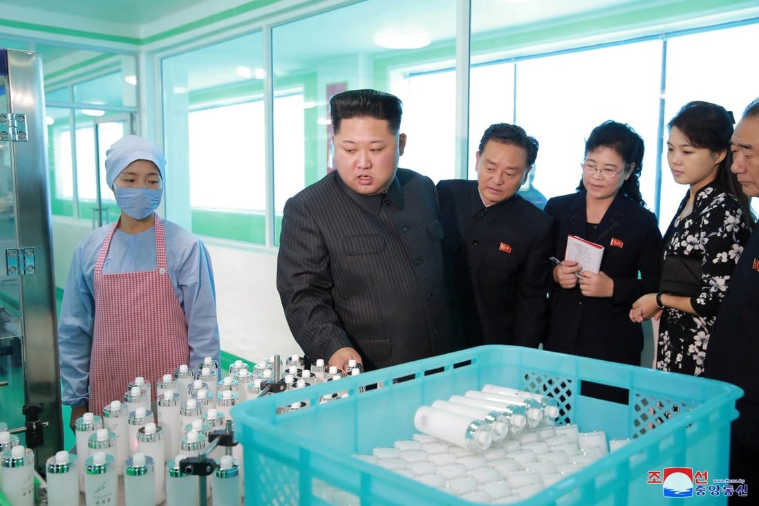 North Korean leader Kim Jong-un and his wife visit a cosmetics factory in Pyongyang. Another manufacturing sector, apparel, employs thousands in North Korea and contributes significantly to its exports. Photo: KCNA/via Reuters