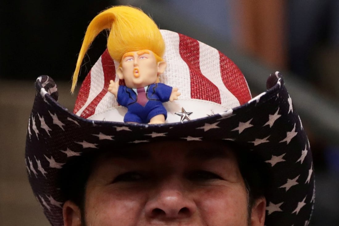 A supporter of the US president wears a Donald Trump hat. Photo: Reuters