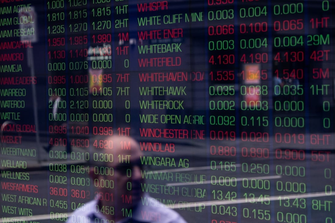 A view of digital market boards at the Australian Stock Exchange in Sydney on March 16. Australian stocks are pacing gains in Asia-Pacific markets after a plan to save jobs and businesses hit by the coronavirus pandemic. Photo: EPA-EFE