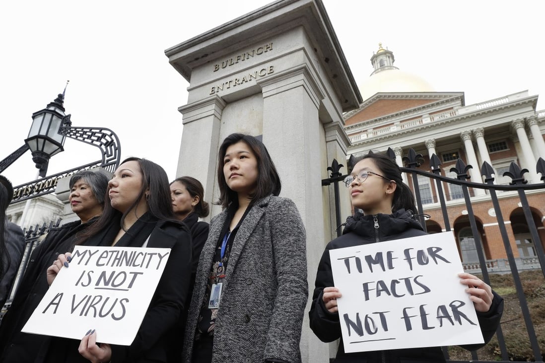 Demonstrators, including members of the Massachusetts Asian-American Commission, protest on March 12 at the statehouse against what racism and fearmongering aimed at Asian communities amid the coronavirus outbreak. Photo: AP