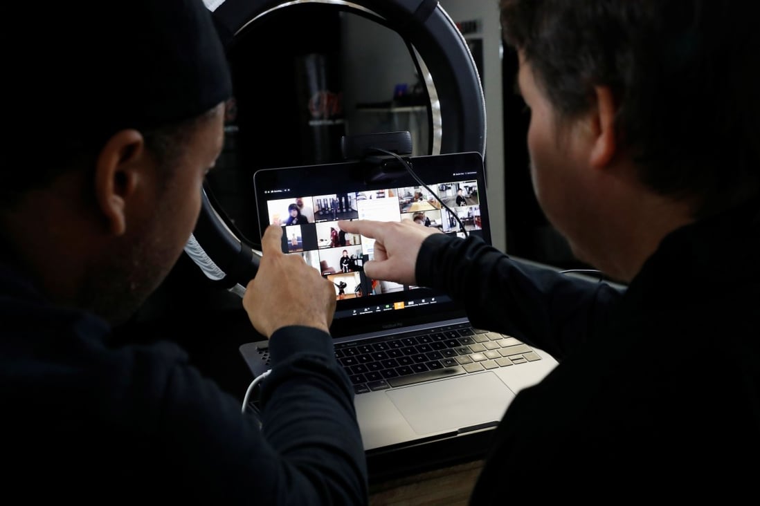 K’waun Conquest (L) and Parris Bender organise students before a live virtual lesson over Zoom at One Martial Arts as California continues its statewide "stay at home order. Photo: Reuters