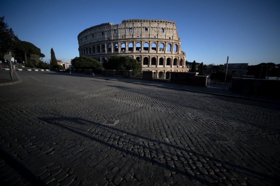 Empty streets outside the Colosseum in Rome. Photo: AFP