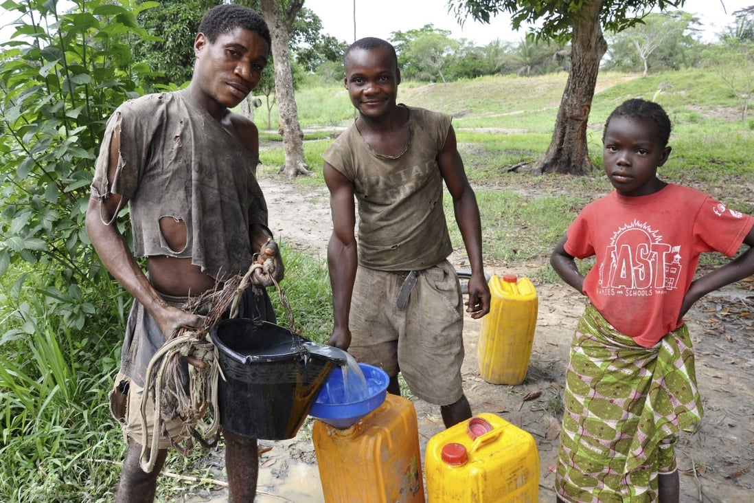 Youths fill jerrycans or ‘bidons’ with water in Ouesso, in the Republic of the Congo. Most of the people in the central African country live in poverty and have little medical or sanitary supplies, but still must face the threat of coronavirus. Photo: Courtesy Joyce Samoutou-Wong