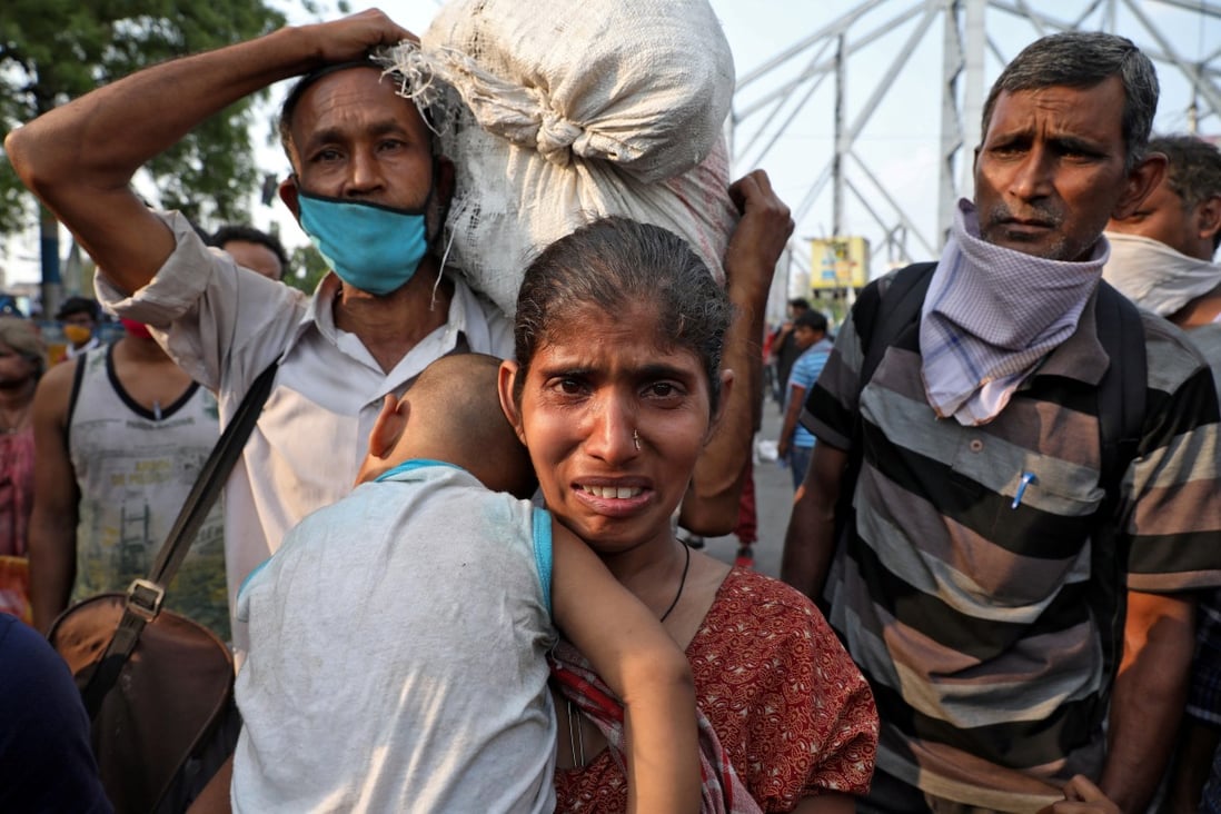 A migrant worker cries after missing out on free food outside a railway station in Kolkata, after India ordered a 21-day nationwide lockdown to limit the spread of the coronavirus. Photo: Reuters