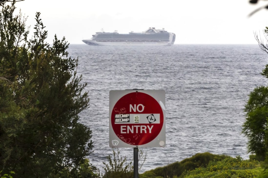 The Ruby Princess cruise ship is seen from Kurnell National Park in Sydney, on Thursday. There are more than 450 Covid-19 infections linked to cruise ships, including 340 cases from the Ruby Princess and 74 from the Ovation of the Seas. Photo: AAP Image