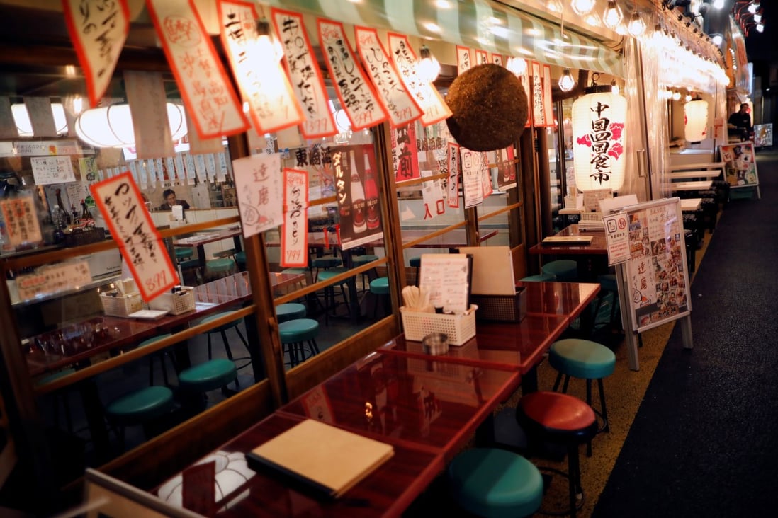 An empty restaurant in Tokyo’s shopping and amusement district of Ginza, which has been hit because of the coronavirus outbreak. Photo: Reuters
