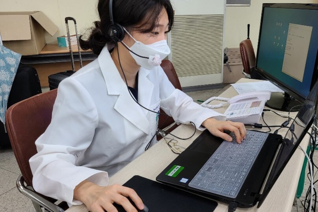 A doctor of Korean medicine communicates with a confirmed Covid-19 patient on March 29 at the Daegu telemedicine centre, temporarily set up at the Daegu Haany University Hospital. Photo: Handout