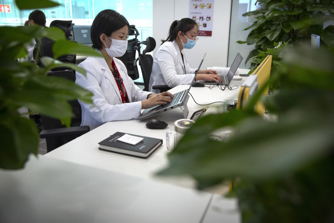 JD Health doctors use computers to chat online as they consult with patients at the JD.com headquarters in Beijing, March 27, 2020. Photo: AP