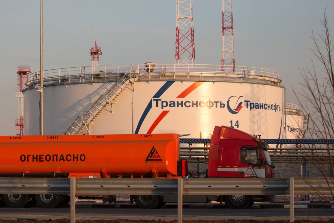 A gas tanker drives past oil storage tanks at the Volodarskaya line operation dispatcher station, operated by Transneft PJSC, in Konstantinovo village, near Moscow on April 7, 2020. Top oil producers have reached a deal to cut output. Photo: Bloomberg