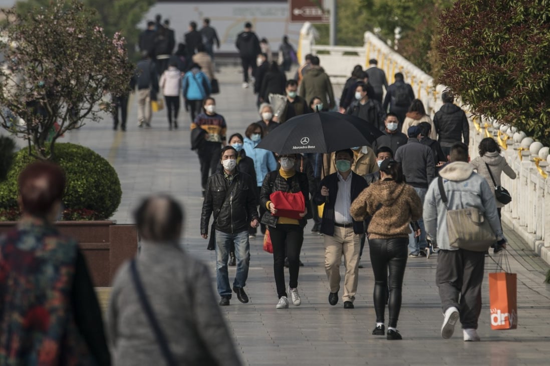 Visitors walk through a public cemetery during the Ching Ming Festival in Shanghai, earlier this month. There were signs of a revival in tourist activity during the holiday. Photo: Bloomberg