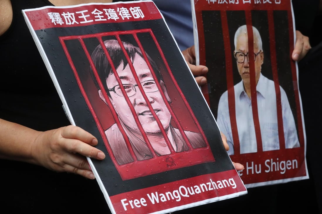 A picture of Chinese human rights lawyer Wang Quanzhang is held up during a silent protest outside the Hong Kong Court of Final Appeal, on July 9, 2018, the third anniversary of China’s “709” crackdown on human rights lawyers. Photo: K.Y. Cheng