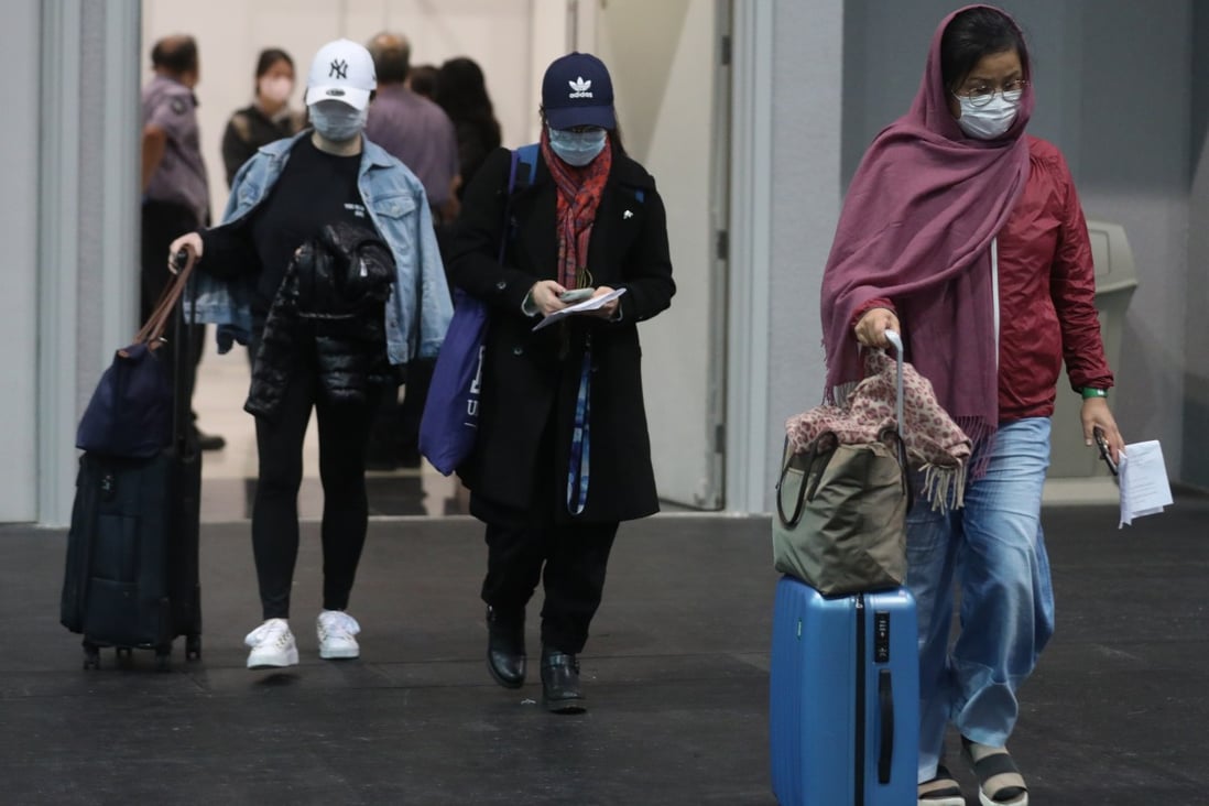 People leave after being tested for the coronavirus at Asia-World Expo in Hong Kong. Photo: Winson Wong