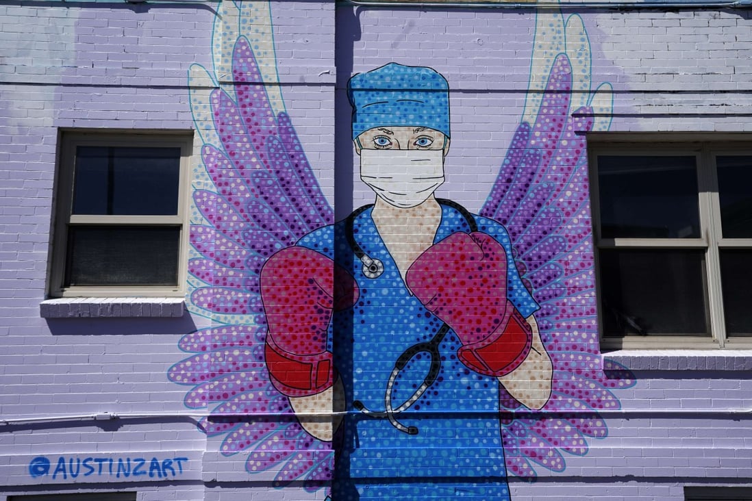 A mural depicting a medical worker in downtown Denver, United States. Photo: AFP