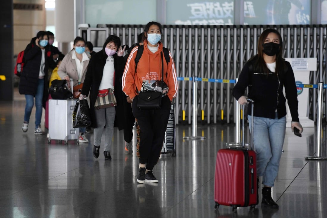 Passengers arrive on a domestic flight at the Beijing Capital Airport on March 27, 2020. Photo: Agence France-Presse