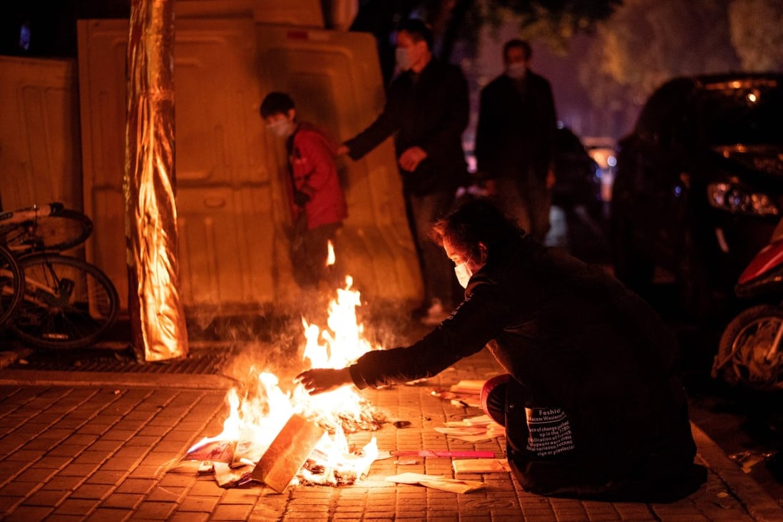 Wuhan residents burn paper offerings for the dead during the annual tomb-sweeping festival in early April. Photo: AFP
