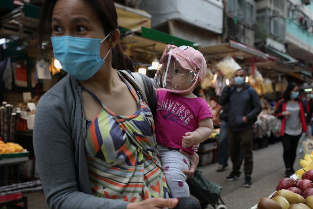A woman and a child don face protection amid Hong Kong’s coronavirus outbreak. Photo: Xiaomei Chen