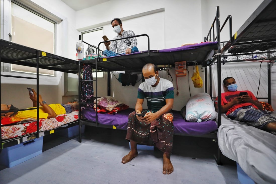 Migrant workers in their room at the WestLite Toh Guan dormitory in Singapore. Photo: EPA