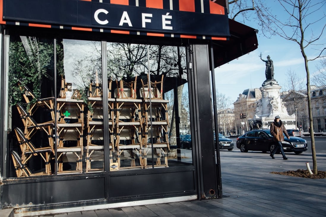 Chairs sit stacked inside a closed cafe in Paris, France. Photo: Bloomberg