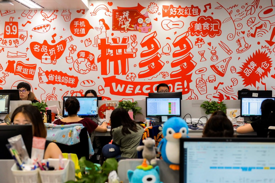 Staff members are seen at their desks inside the headquarters of Pinduoduo in Shanghai. Founded in 2015, the company operates China’s biggest e-commerce platform for agricultural goods. Photo: Reuters