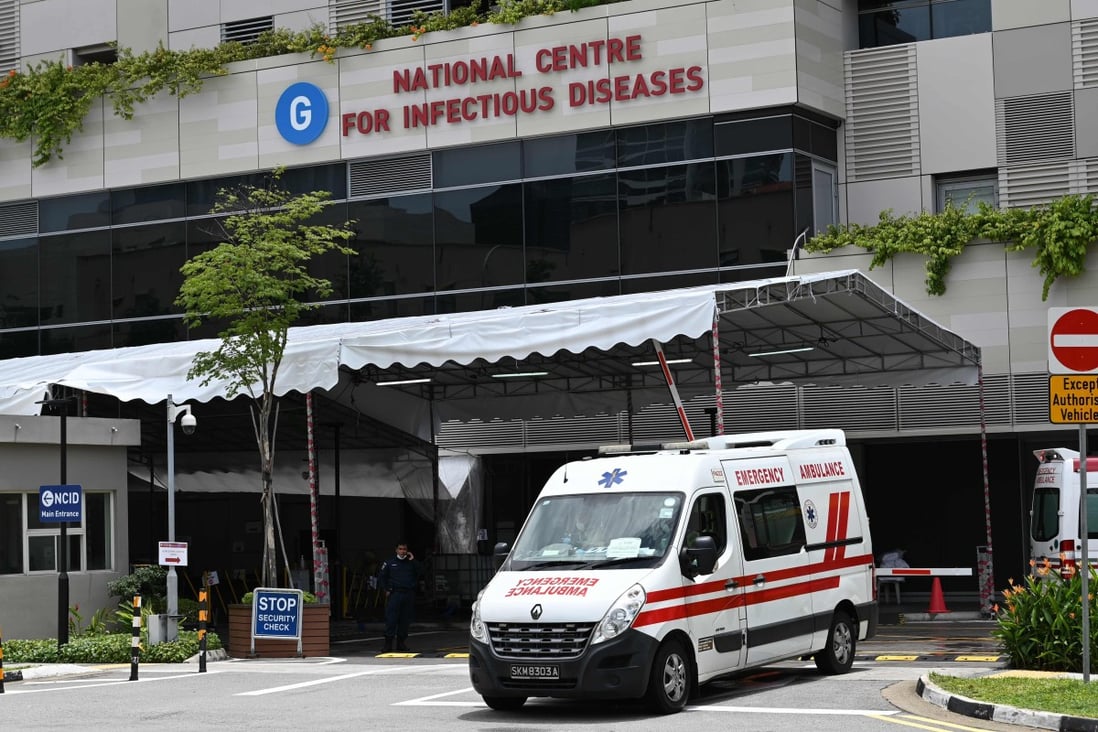 An ambulance leaves the National Centre for Infectious Diseases, where Covid-19 patients are being treated. Singapore has over 11,000 acute care hospital beds in public and private hospitals. Photo: AFP