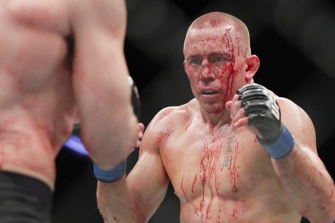 Georges St-Pierre faces Michael Bisping during their middleweight title bout at UFC 217. Photo: AP