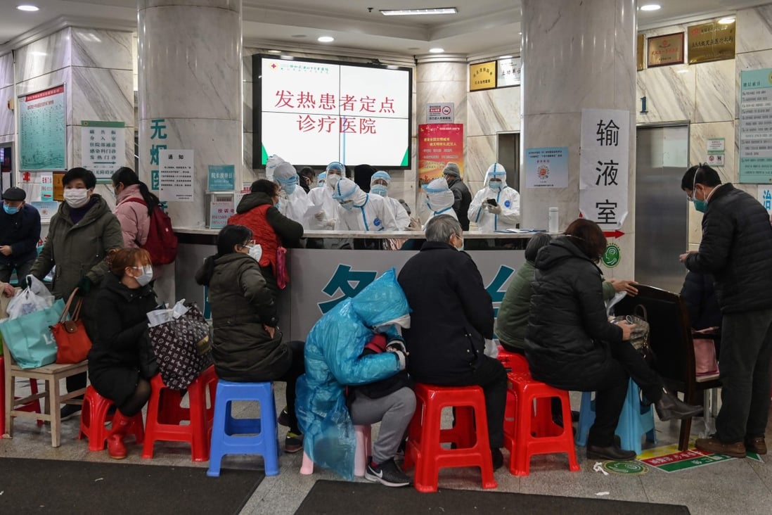 Medical staff in protective clothing try to cope with an influx of patients Wuhan Red Cross Hospital in the early days of the coronavirus epidemic. Photo: AFP