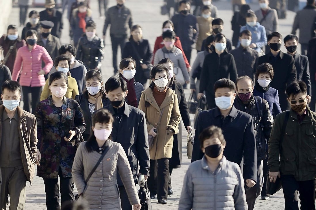 Masked people commute in Pyongyang. Food prices in North Korea have reportedly risen sharply because of panic buying. Photo: Kyodo